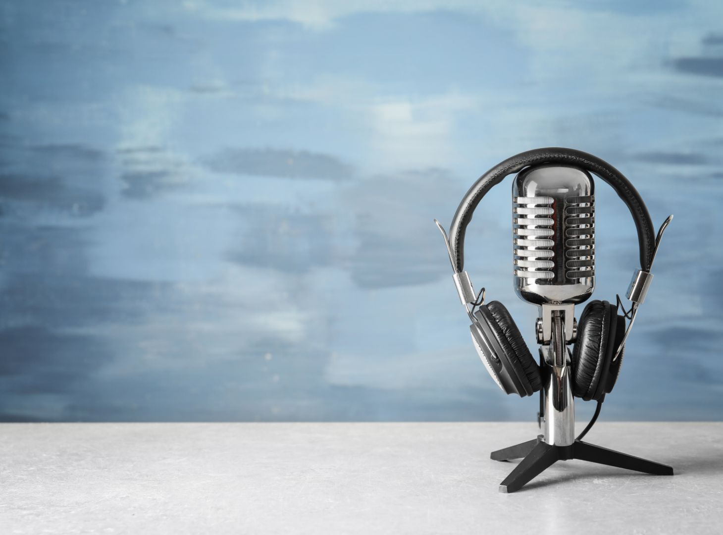 Headphones resting on a microphone