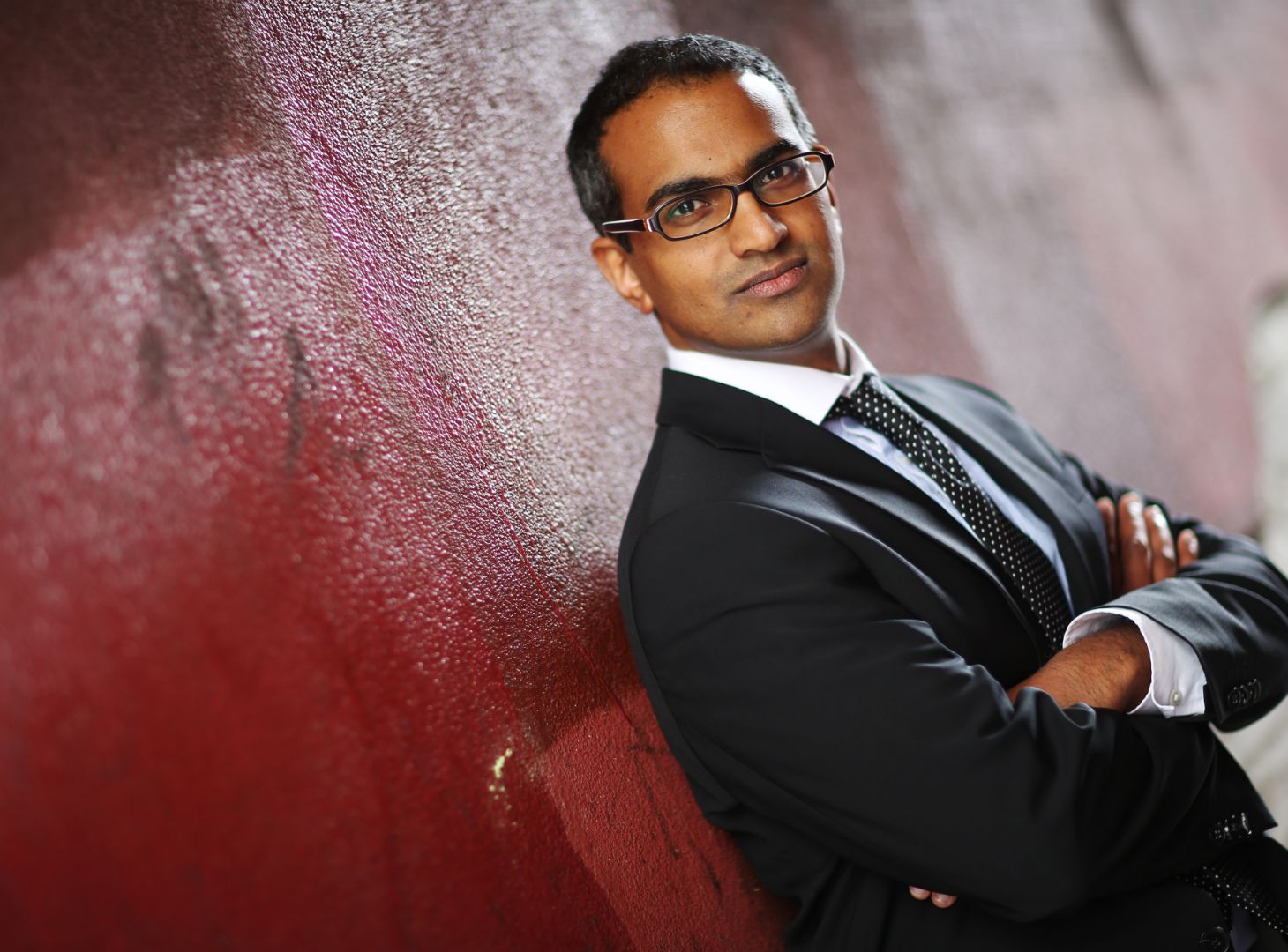 Image of Paul Koshy stood next to a wall