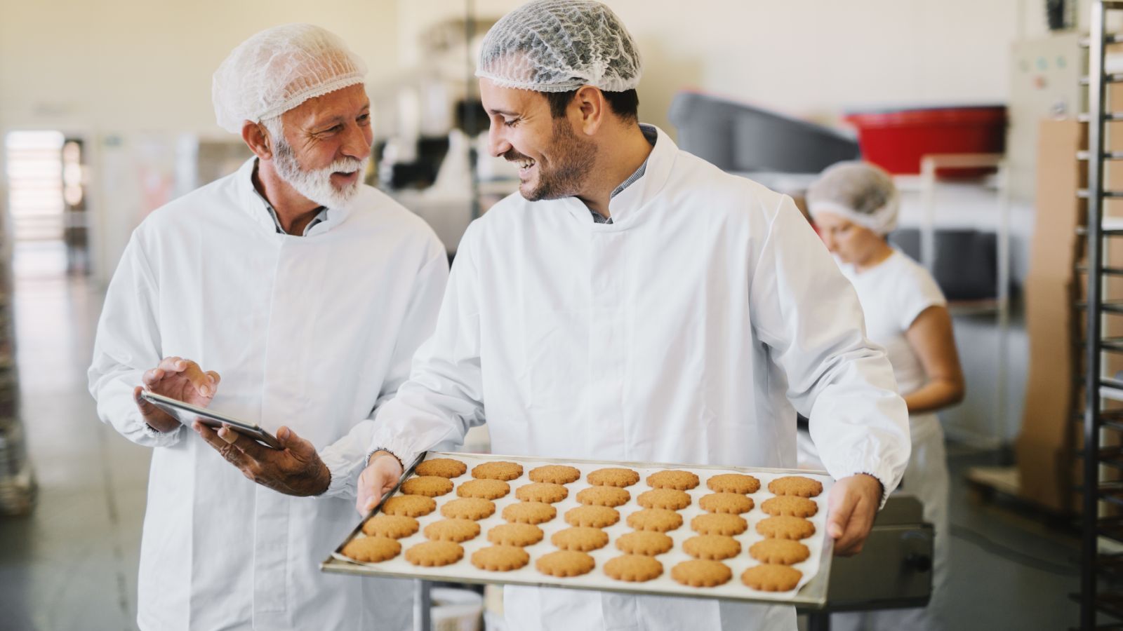 Two factory workers holding a discussion