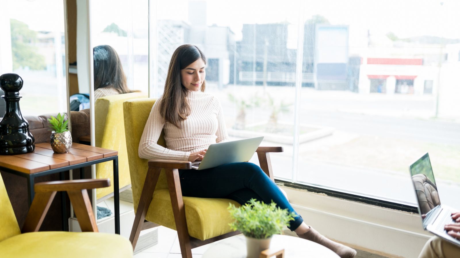 Business owner applying for their R&D tax credit claim in a cafe