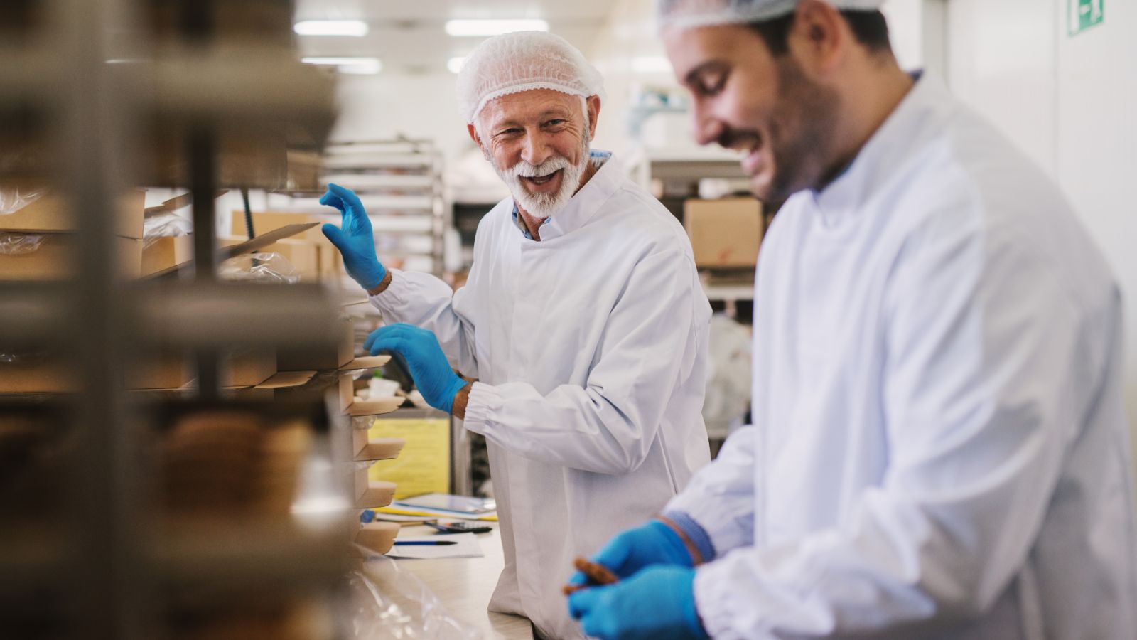 Workers on a production line having a conversation