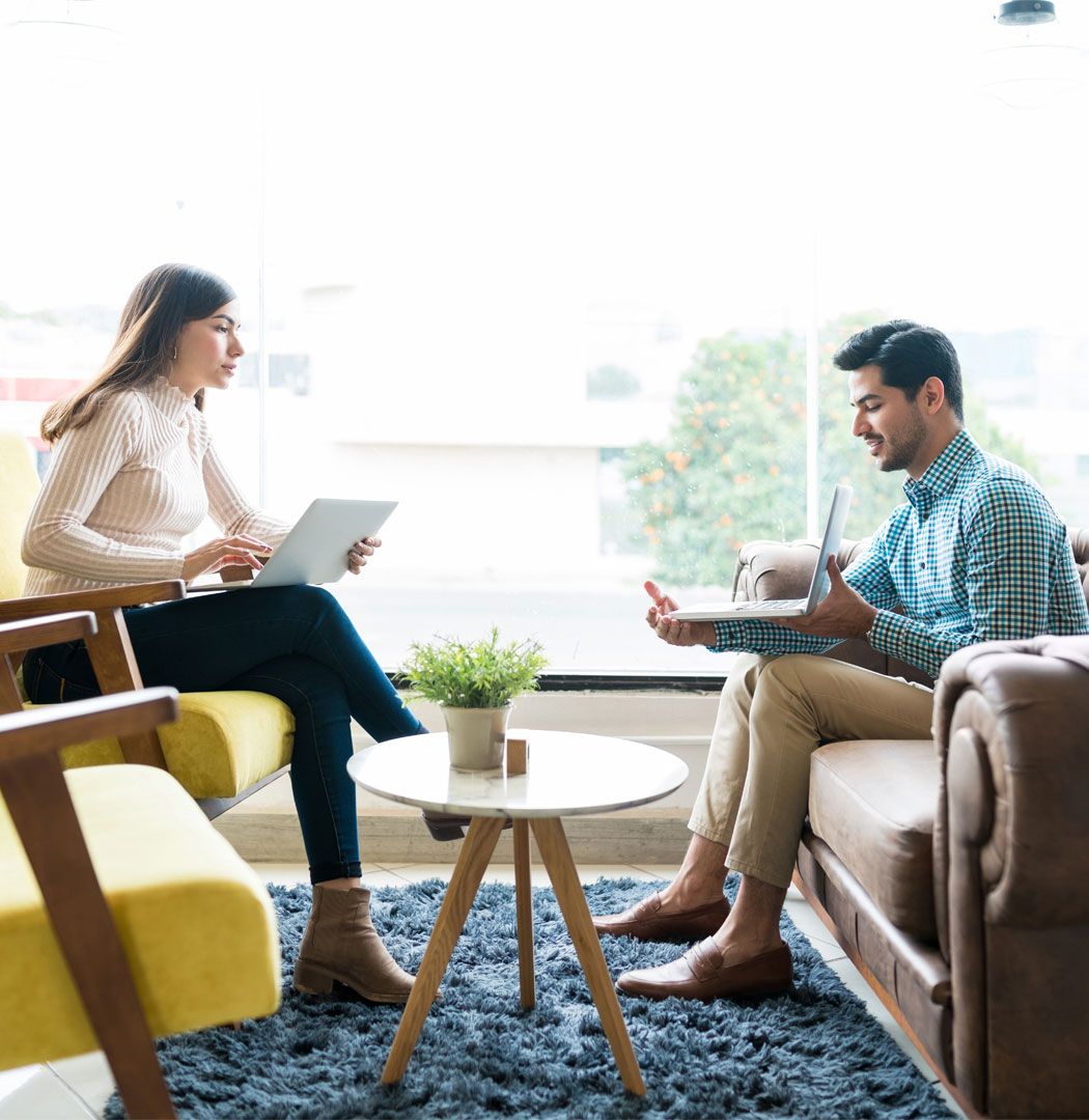 Accountant showing a business owner data on his laptop during a meeting