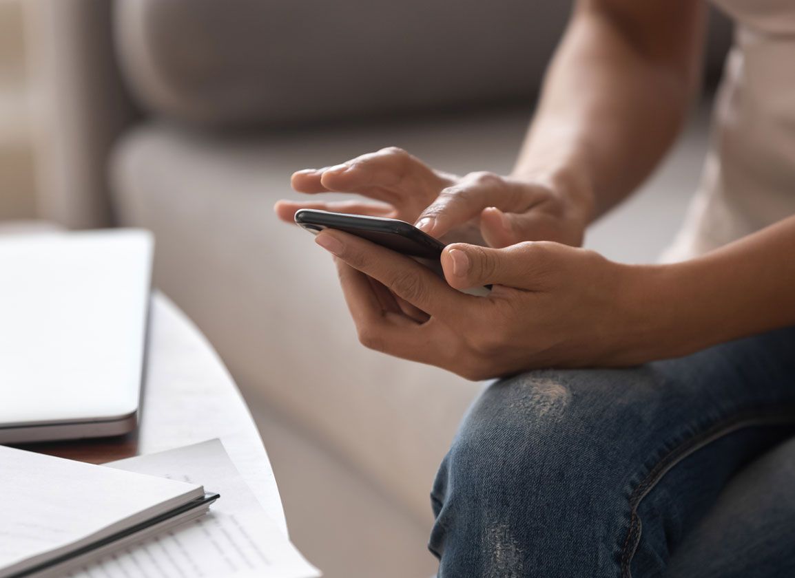 Business owner viewing their finances on their phone